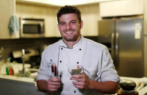 Chef Sayegh holds marijuana buds and THC (Tetrahydrocannabinol) and CBD (Cannabidiol) oils as he poses in his kitchen in Los Angeles